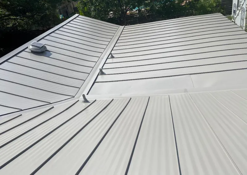 Solar attic fan installed on a metal roof for Roof Ventilation in Wanaque